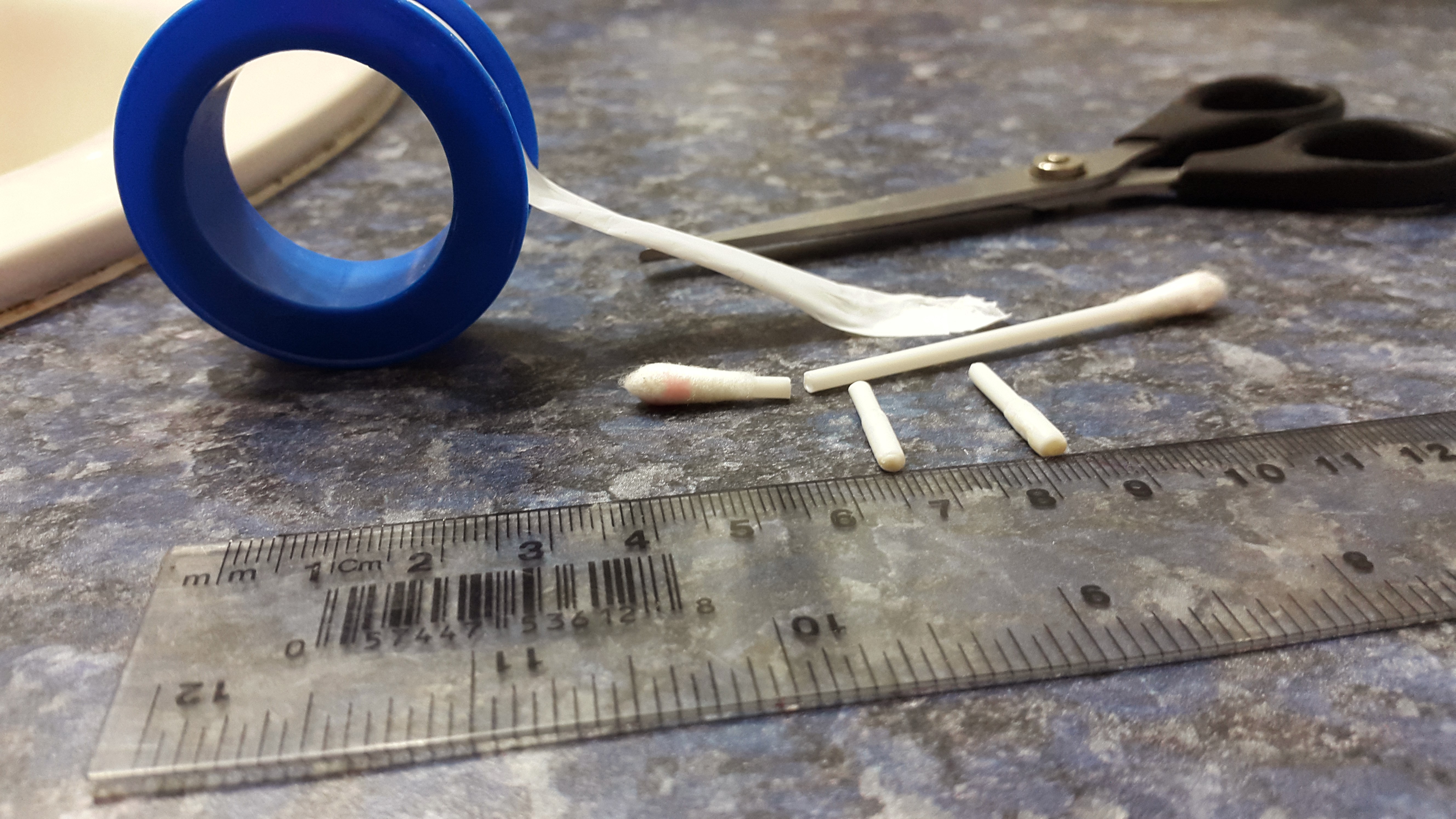 Build your own flesh plugs from cotton swabs and PTFE tape